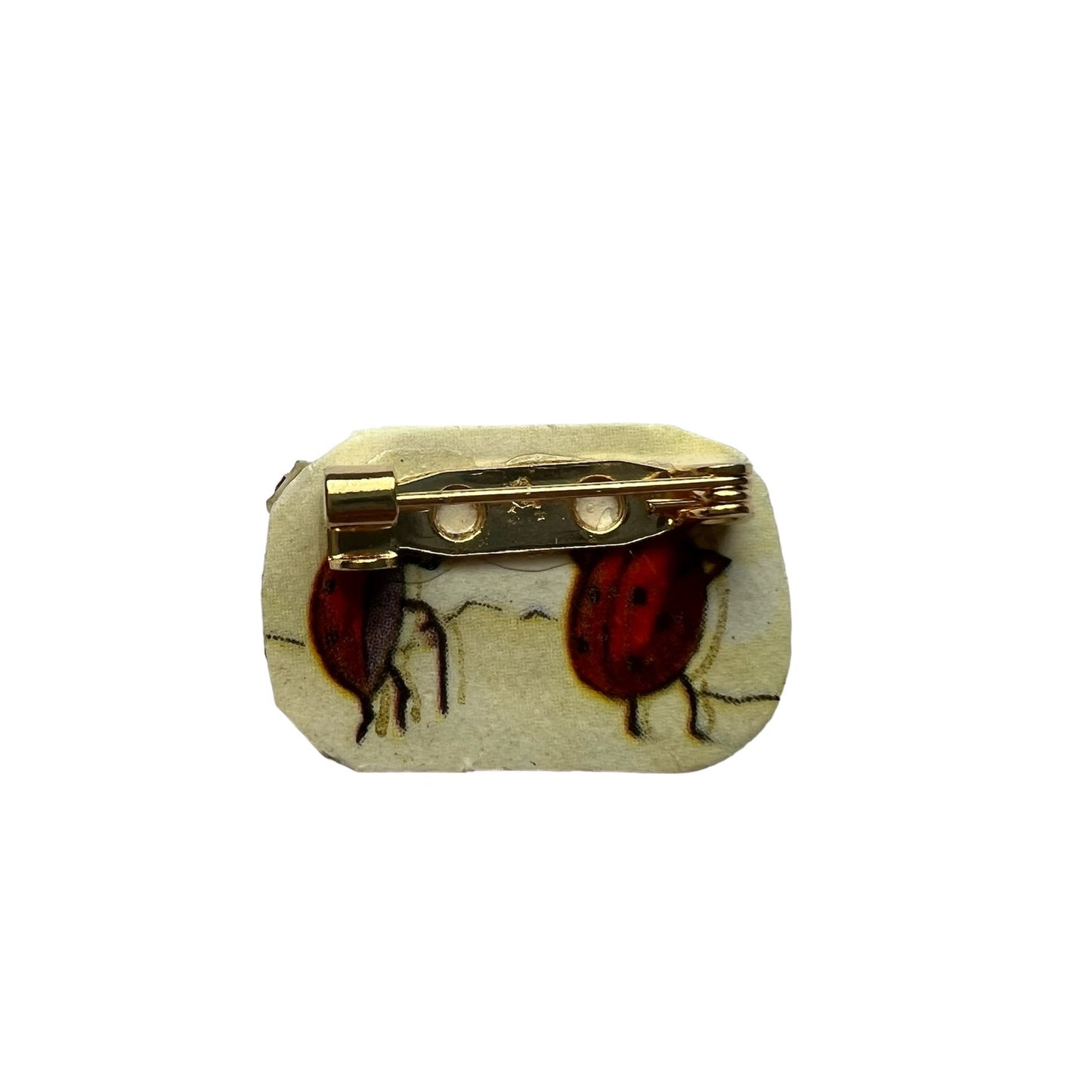 spilla TEZEE "cool" con profilo strass rossi